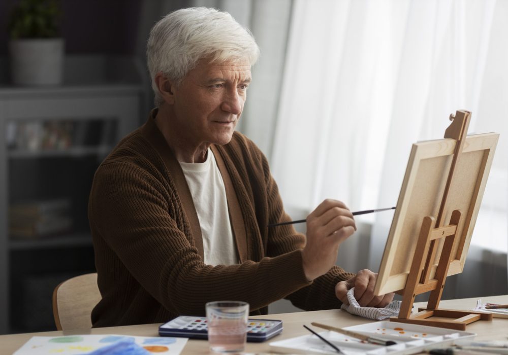 senior-painter-using-watercolor-his-art